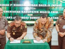 Pj Bupati Bersama Kajati Sumsel Tandatangani NPHD Dukungan Pembangunan Sport Center, Parkir dan Mess di Kejati Sumsel